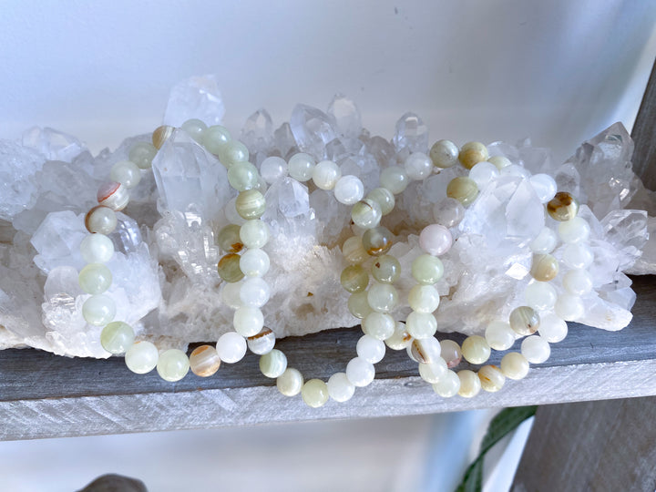 Necklace with small beads on a white stone surface