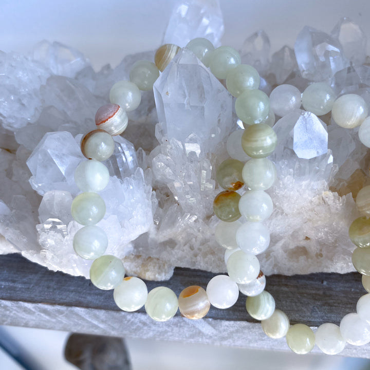 Necklace with green beads on a crystal background