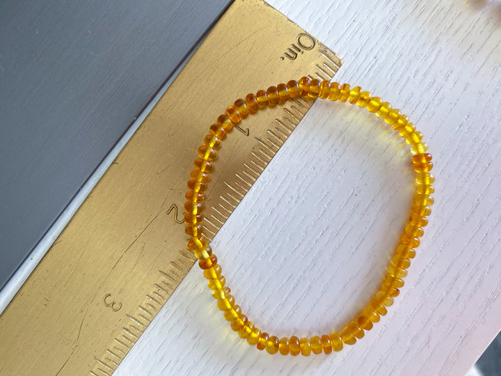 Manifestation: Beaded Cylinder Amber Stretch Bracelet