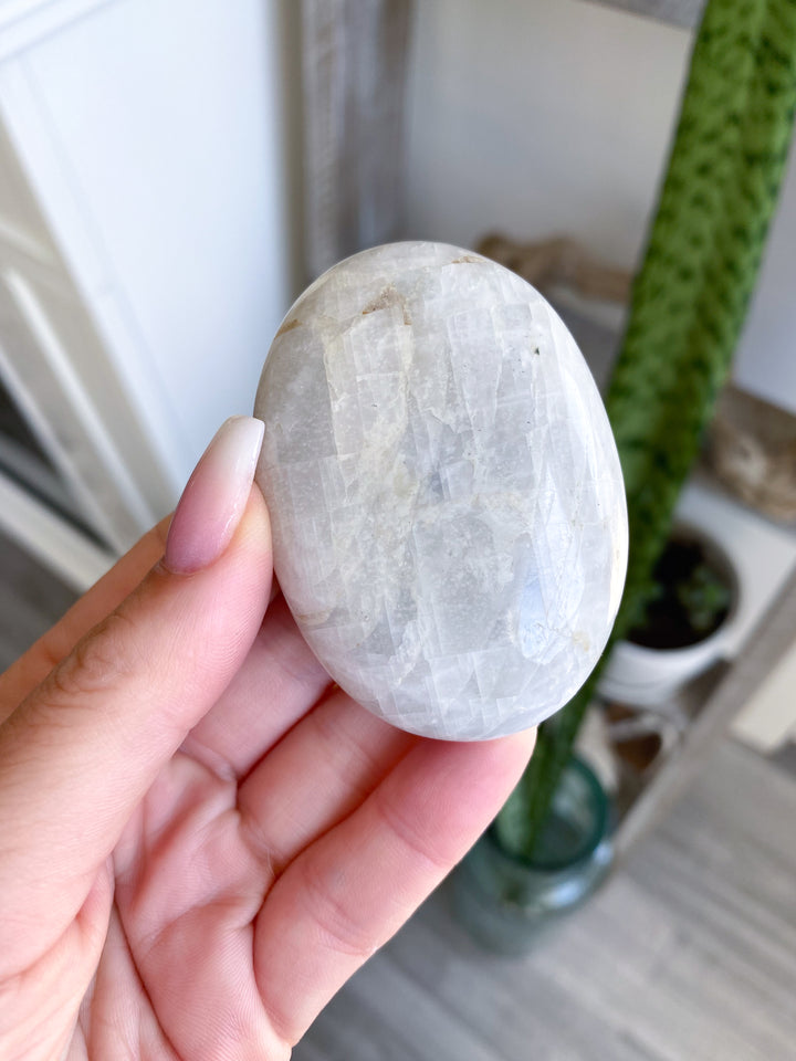 White, Egg-like Rainbow Moonstone Palm #1