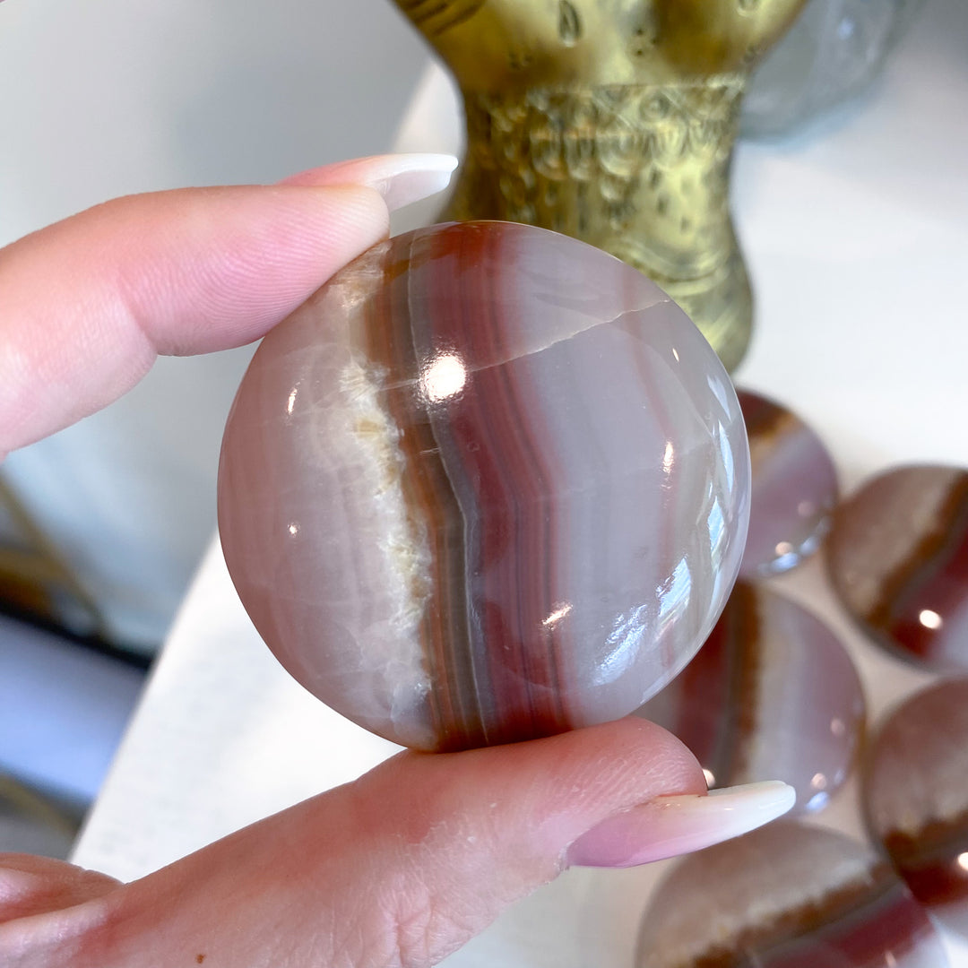 Large Banded Pink Onyx Coin