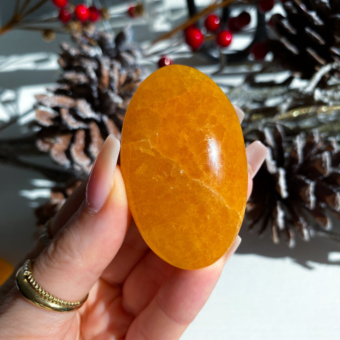 Bright, Juicy Orange Calcite Palm Stone