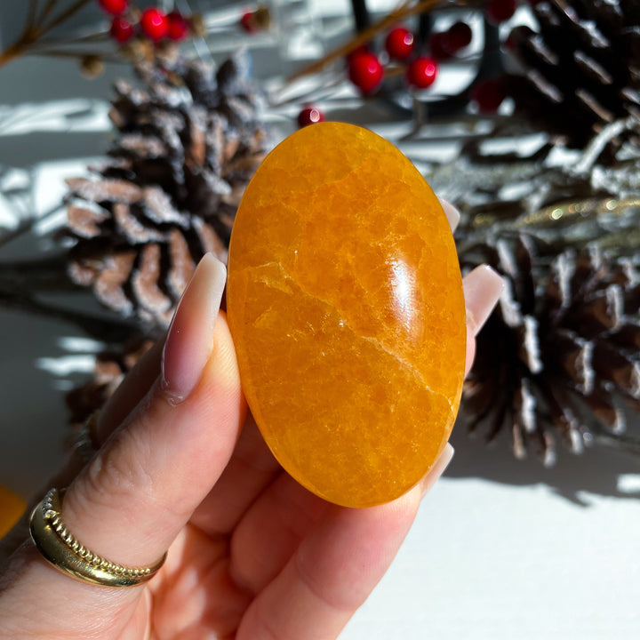Bright, Juicy Orange Calcite Palm Stone