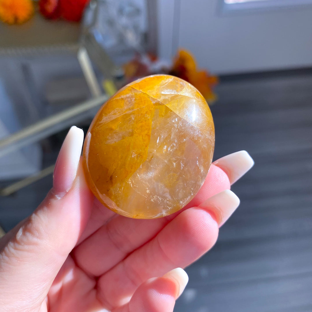 Golden Healer Quartz Pebble Palm 
