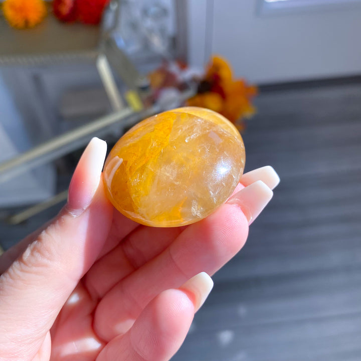 Golden Healer Quartz Pebble Palm 