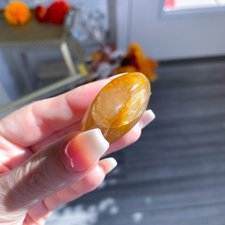 Golden Healer Quartz Pebble Palm 