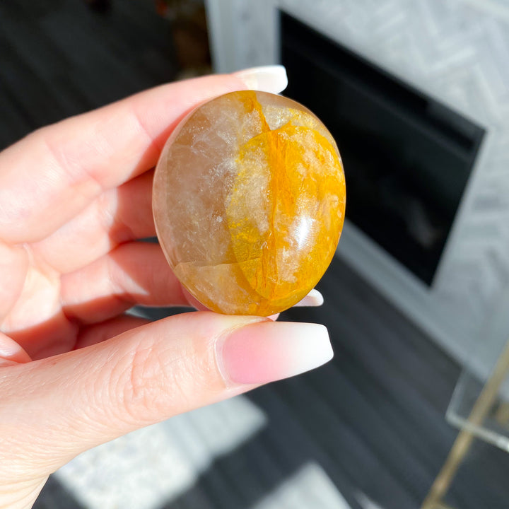 Golden Healer Quartz Pebble Palm 