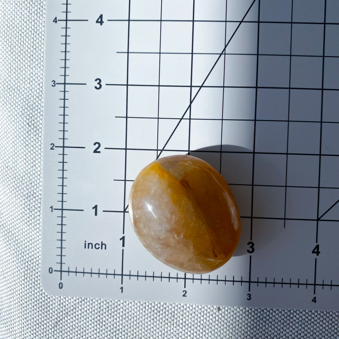 Golden Healer Quartz Pebble Palm 