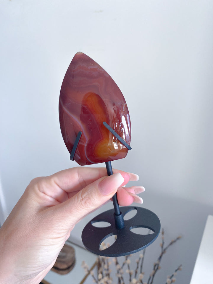 Shiny Carnelian Flame on Black Stand