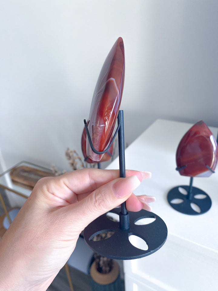Shiny Carnelian Flame on Black Stand